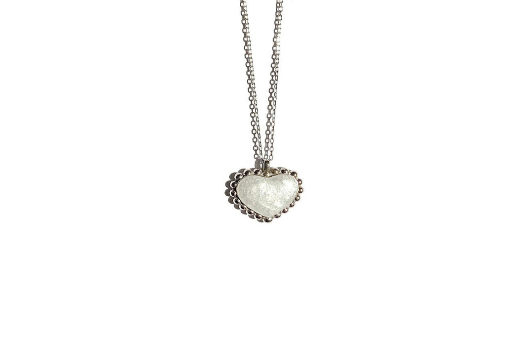 SIlver Heart Pendant with dots on the edge and mother milk in white resin