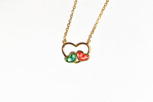 Afbeelding in Gallery-weergave laden, Gold Plated Silver Bezel Cup Necklace Two small Hearts with baby teeth in green en pink resin In big Heart 

