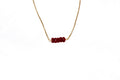 Moderne 'Ami' ketting met rode robijn van  Néhlia.