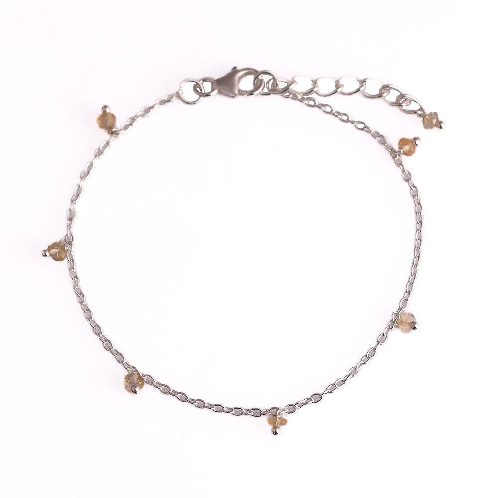 Zilveren Orb geboortesteen armbandje met gefacetteerde gele citrien, modern strak design van Néhlia.